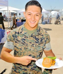 Laser-printed messages adorn sandwiches at Carnival Cruise Line's First Ever Socially Powered BBQ at Marine Corps Air Station Miramar on July 5, 2017 in San Diego, California. 