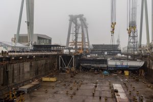 The coin block is moved to MSC Seaview's hull in drydock.