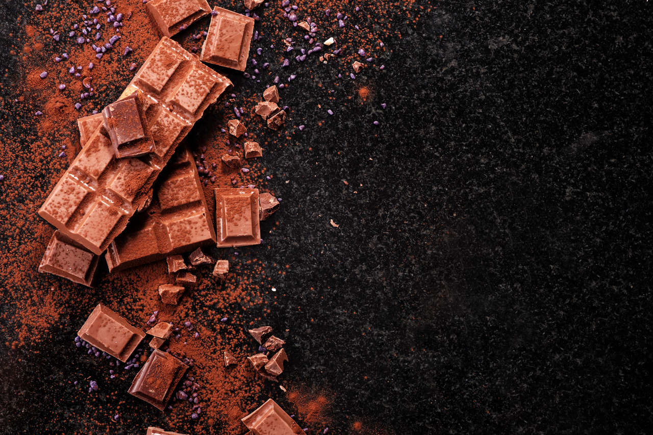 A moody, brown image of chocolate and cocoa powder. Photo: Costa Cruises