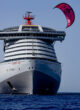 Tom Bridge completes his kitesurf from Deck 16 of Virgin Voyages' Resilient Lady, approximately 129 feet above the harbor of Delos, Greece. CREDIT: Alex Grymanis / Red Bull