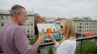 Bill Panoff and Audrey Balbiers-Panoff toasting each other in Montreal.