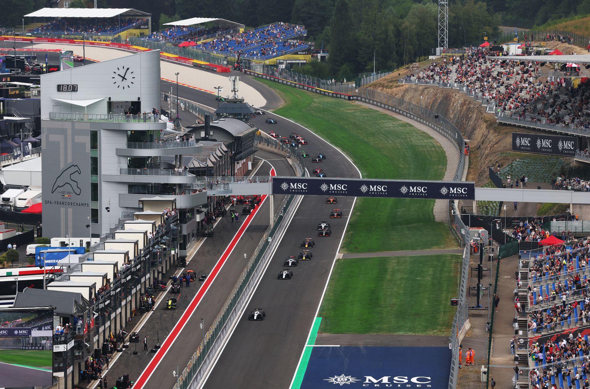 Formula 1 in Belgium, cars speeding around the track.