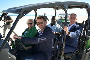 Golf cart carrying Hon. Glenys Hanna-Martin, Minister of Tourism, Stefano Mosconi, Vice President of Global Construction, CTL Maritime, Hon. Phillip Davis, KC, MP, Prime Minister, and Pierfrancesco Vago, Executive Chairman, MSC Group’s Cruise Division