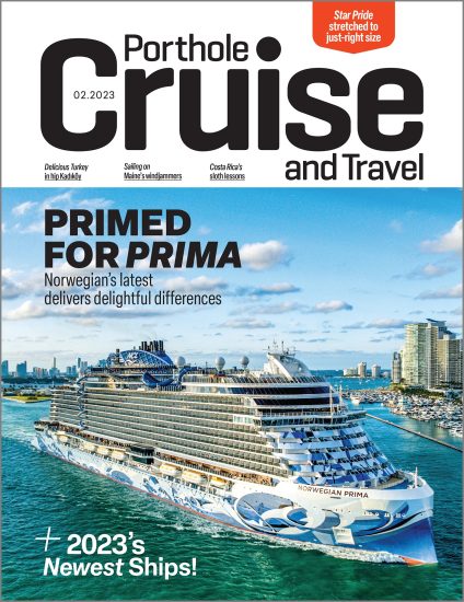 Norwegian Prima sails out of Miami's Government Cut on the cover of the Jan/Feb 2023 issue of Porthole Cruise and Travel Magazine